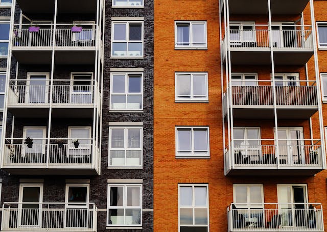 Many apartment windows with balconies